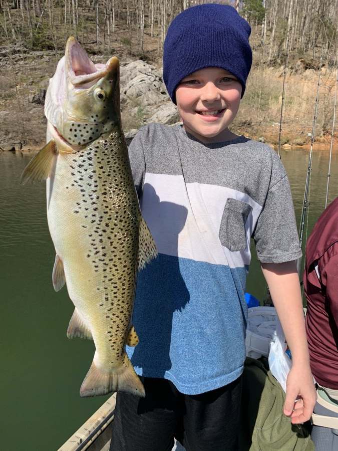 Aaron with a brown trout nearly as long as he was wide.