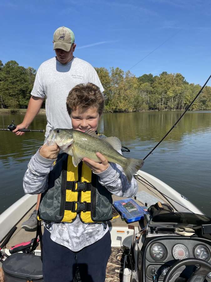 Aaron at twelve, in the life jacket, with a good one. October colours coming in.