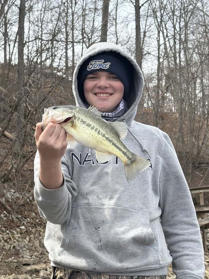 Bundled up on a grey March day. The fish don't care.