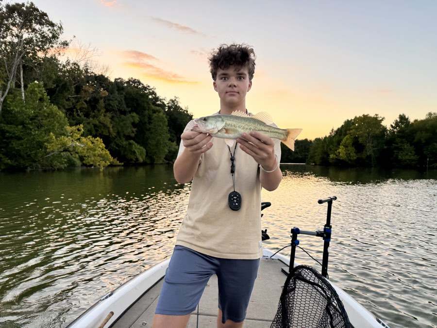 Aaron at last light with a white bass.
