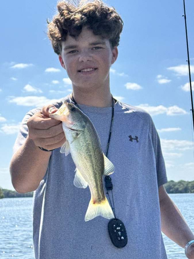 Blue sky and a bass in hand.